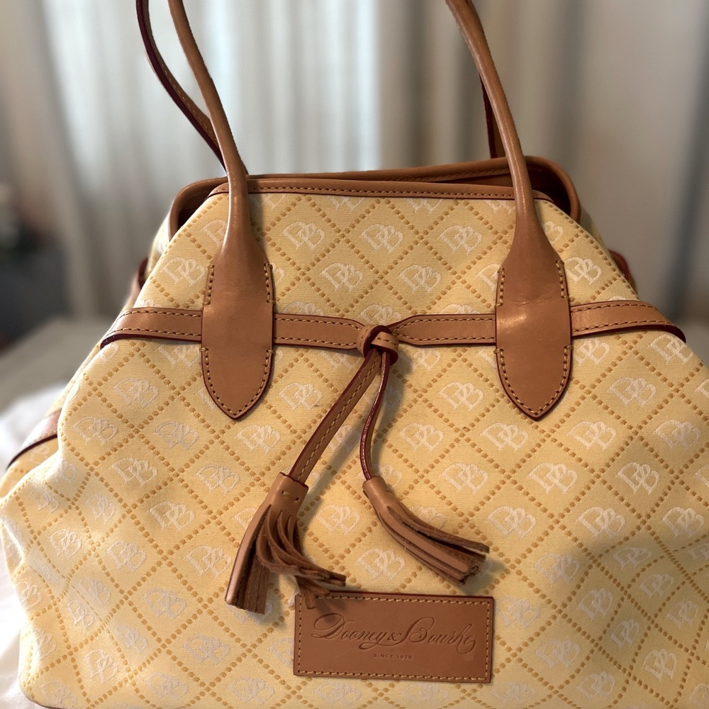 Pale yellow Dooney & Bourke Mara bag.
